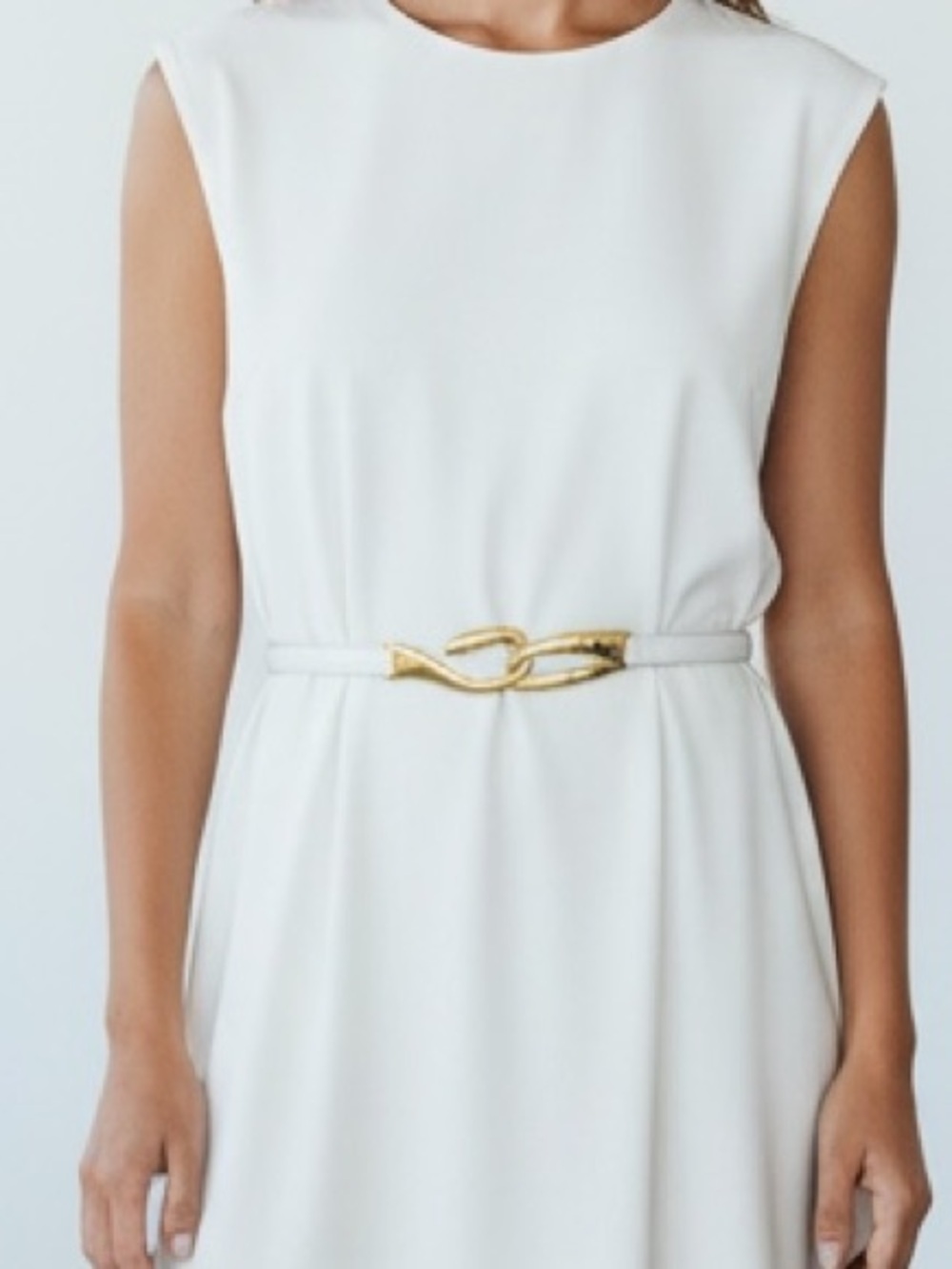 White and Gold Danier Leather Belt distinctive interlocking hook buckle closure